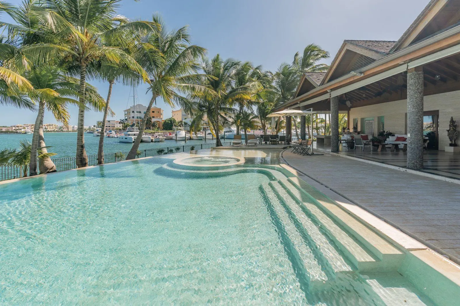 Pools under the palms at the edge of the water