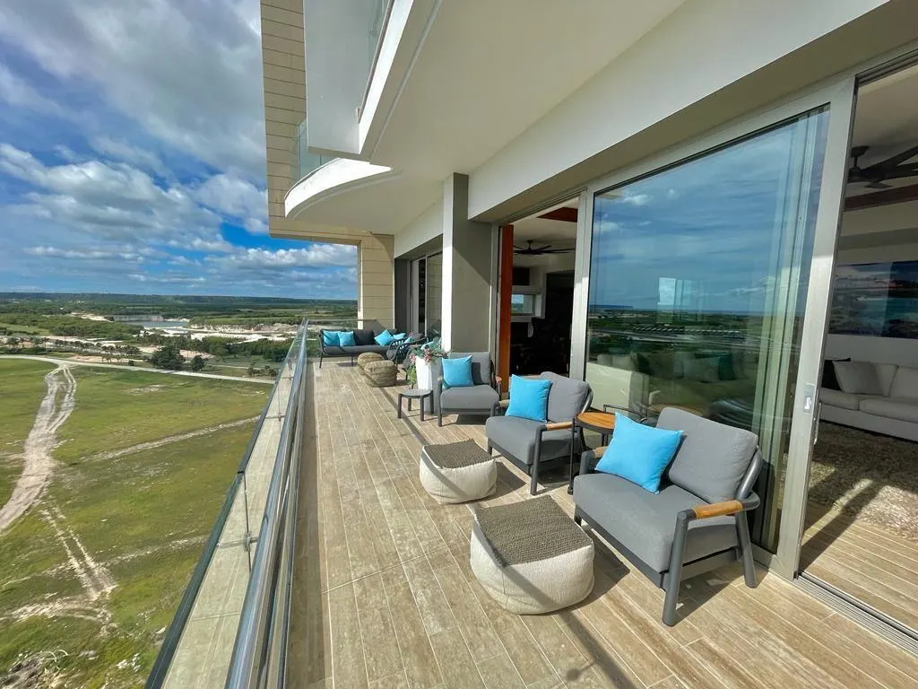 A long terrace with chairs, the view over Cap Cana
