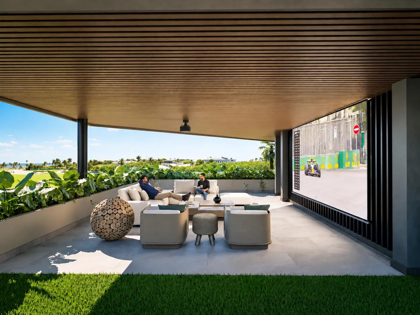 A covered terrace with sofas opening onto the garden and the green