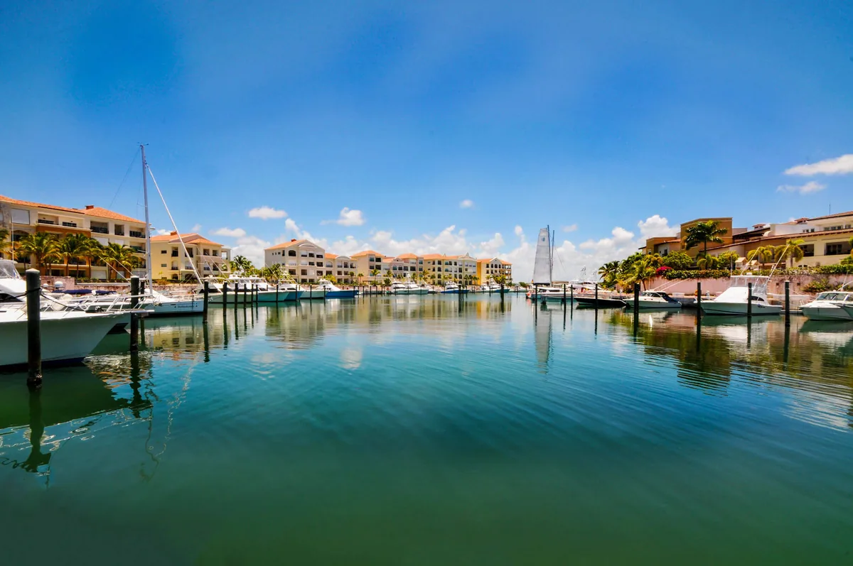 The still water of the Marina, yachts and buildings along the quay
