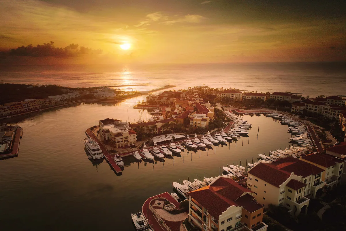 The Marina from the air at dawn, lit gold by the rising sun