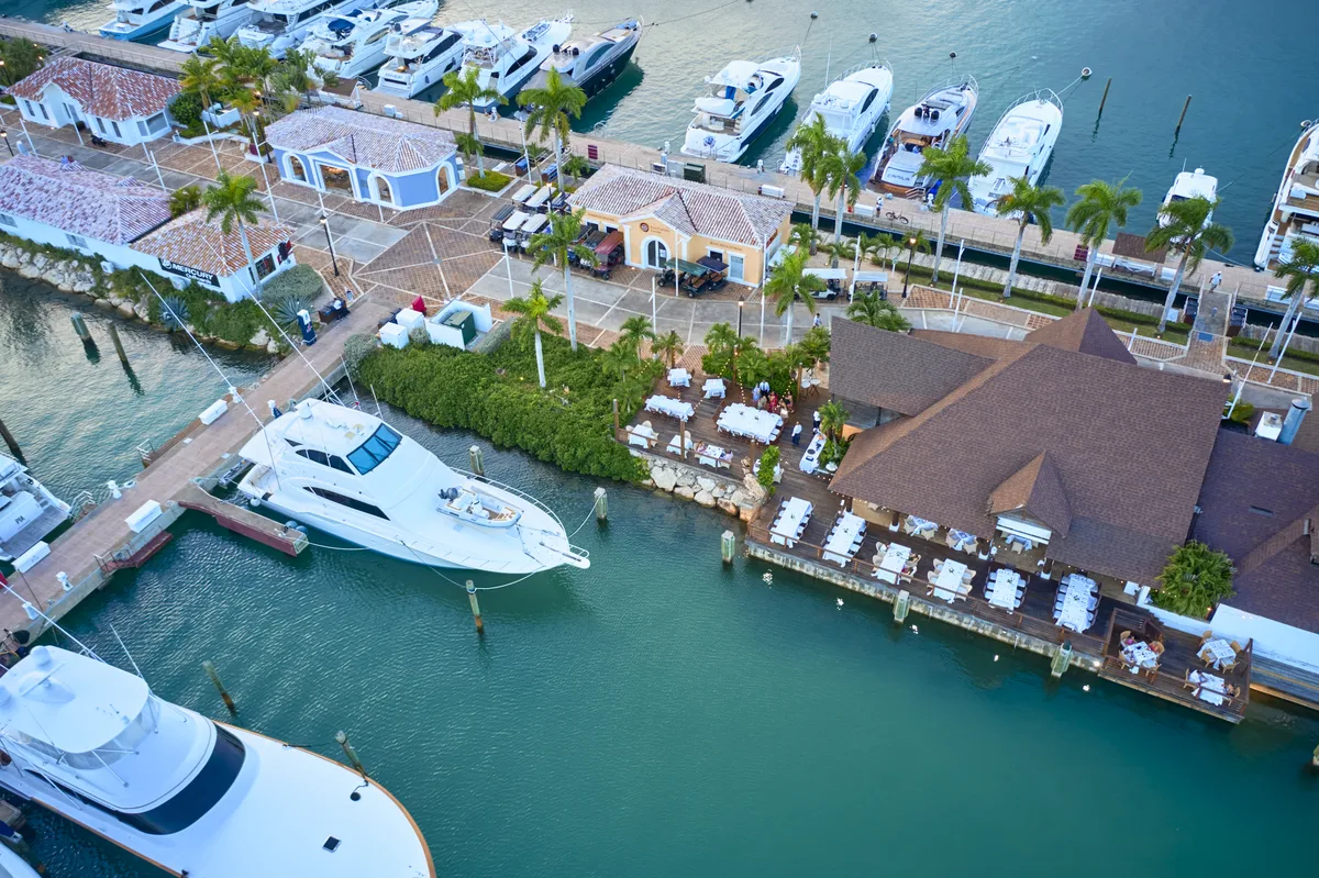 The marina of Casa de Campo from the air: restaurants, boutiques and yachts at the pontoons